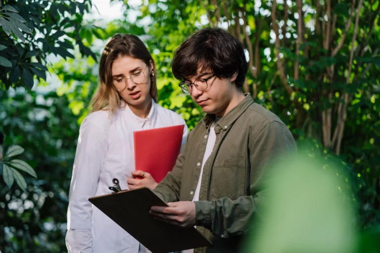 young-agricultural-engineers-working-greenhouse Image description
